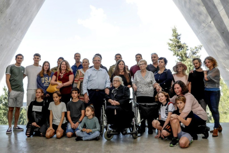 Melpomeni Dina Gianopoulou poses with the children and grandchildren of the Mordechai siblings her family hid from Nazis during World War II in Greece