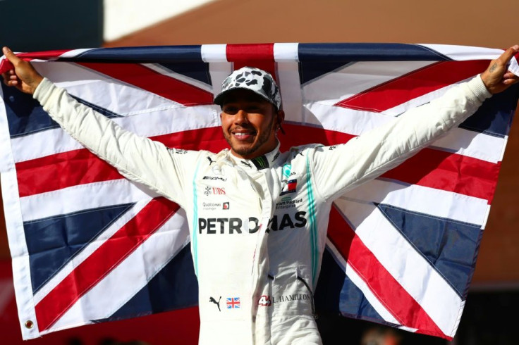 Lewis Hamilton celebrates his sixth world title