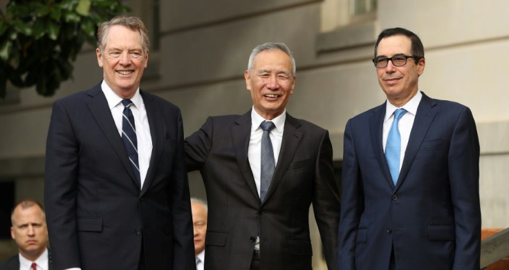 Liu He (C) hailed phone talks with US Trade Representative Robert Lighthizer (L) and Treasury Secretary Steven Mnuchin (R)