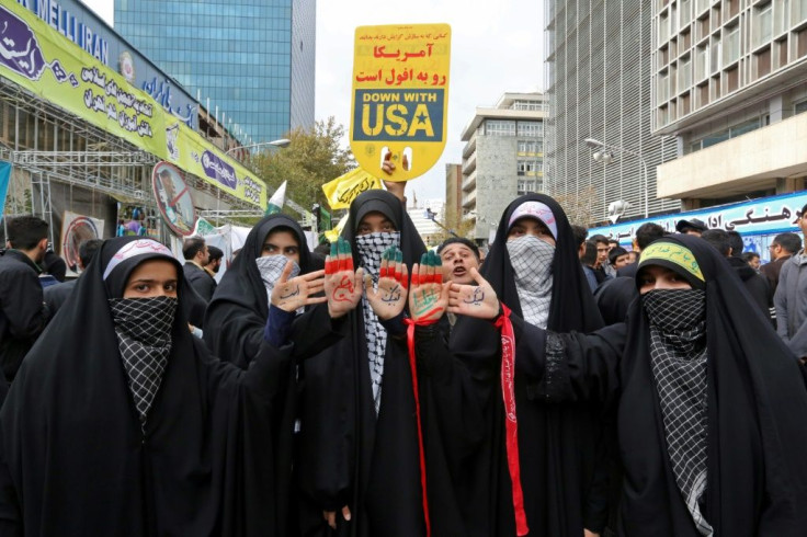 These women joined the rally with religious symbols drawn on their palms