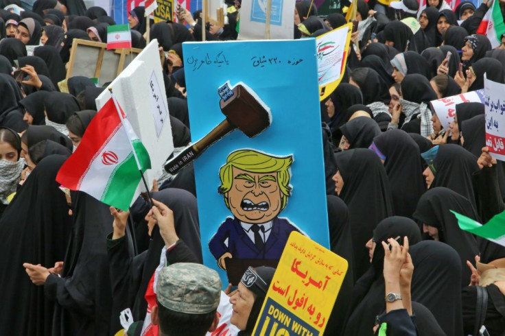 A placard mocking US president donald Trump during a rally outside the former US embassy in the Iranian capital Tehran on November 4, 2019, to mark the 40th anniversary of the Iran hostage crisis
