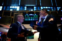 Traders work during the opening bell at the New York Stock Exchange (NYSE) on November 4, 2019 in a session that would produce records for the Dow, S&P 500 and Nasdaq