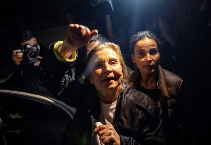 Turkish journalist Nazli Ilicak waves after being released from Bakırkoy women's Prison in Istanbul.