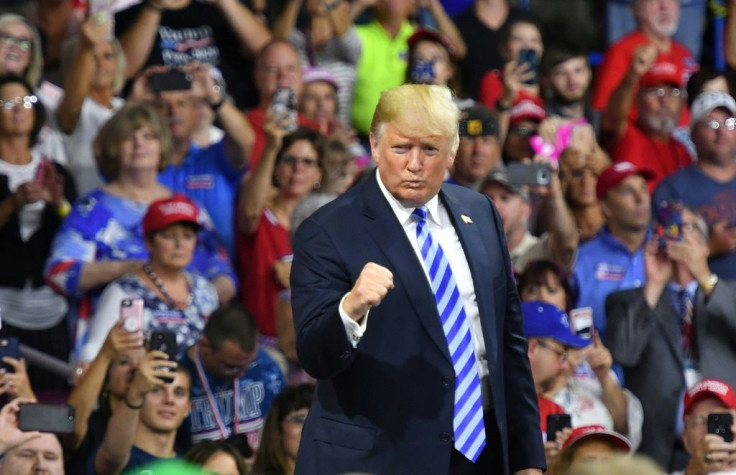 US President Donald Trump salutes supporters in coal-mining West Virginia in August 2018