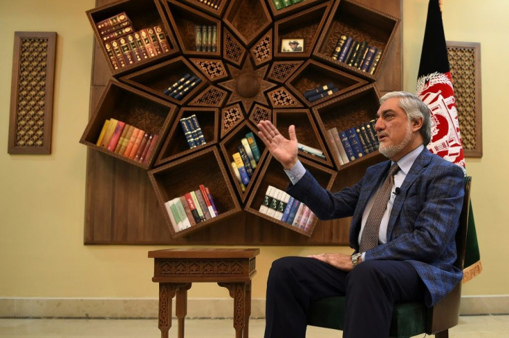Afghan Chief Executive Abdullah Abdullah gestures during an interview with AFP at the Sapedar Palace in Kabul