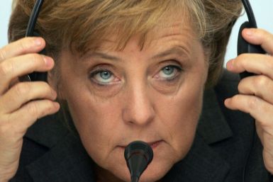 German Chancellor Angela Merkel says if the Berlin hadn't fallen, she would have driving around the US listening to Bruce Springsteen
