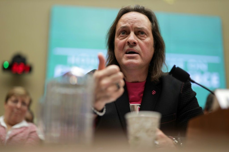 T-Mobile CEO John Legere, seen at a congressional hearing on the merger of the wireless carrier with rival Sprint, would head the new company after the tie-up is completed