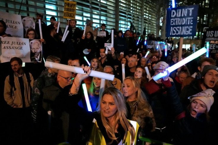 Assange's supporters held up signs decrying the British government and interior minister Priti Patel, who will have to sign off on Assange's extradition once the courts have made their determination