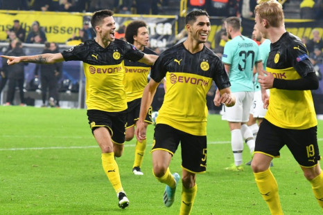Achraf Hakimi (C) celebrate after getting the winner as Borussia Dortmund came from two goals down to beat Inter