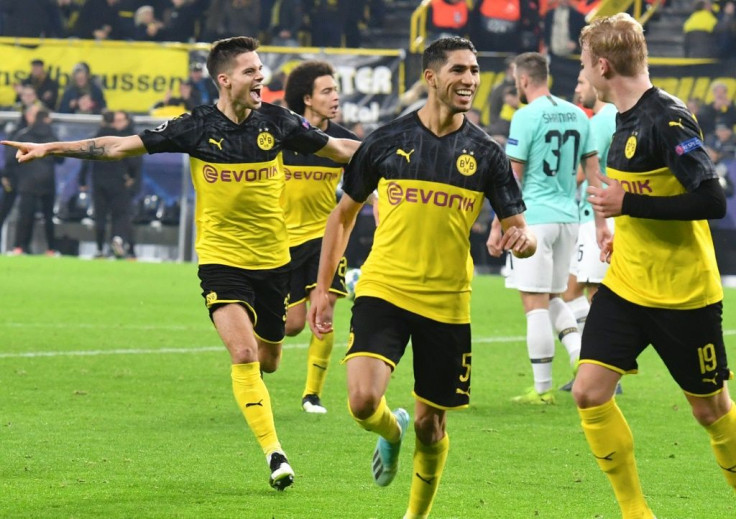 Achraf Hakimi (C) celebrate after getting the winner as Borussia Dortmund came from two goals down to beat Inter