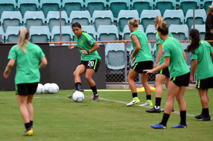 Australia's women footballers such as Sam Kerr, seen here kicking the ball during a Matildas training session, will earn the same as their male counterparts under a landmark deal