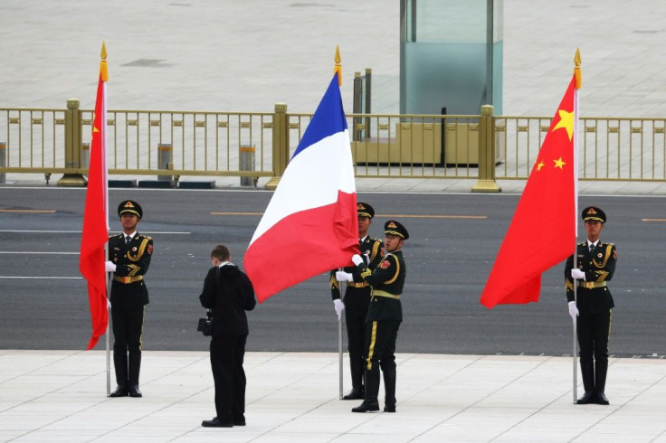 Chinese soldiers take part in a welcome ceremony for French President Emmanuel Macron