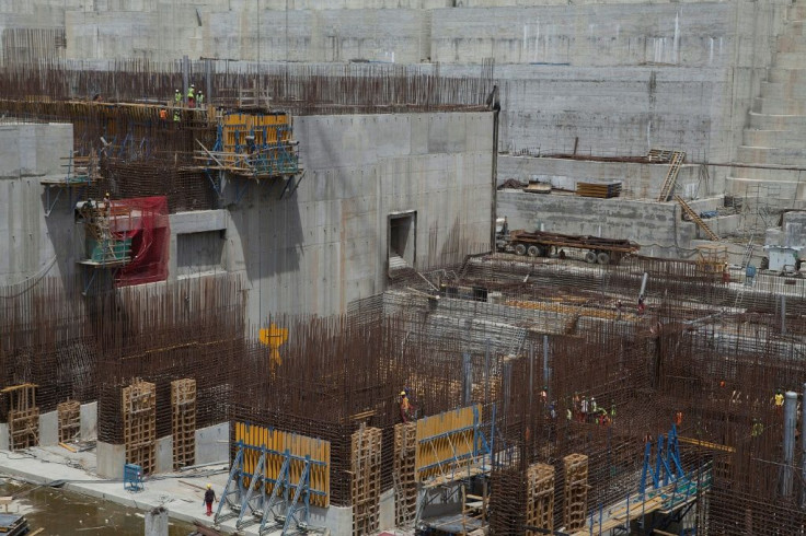Ethiopian workers stand on scaffolding in March 2015 during construction of the  Grand Renaissance Dam