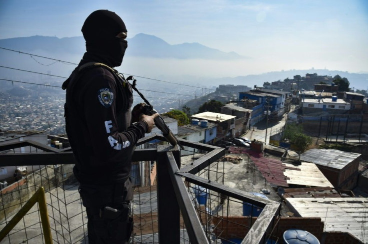 A member of Venezuela's Special Action Forces (FAES) stands guard during a police operation on April 1, 2019 in Caracas -- the force has come under scrutiny for what some say are extrajudicial killings, but the FAES denies any wrongdoing
