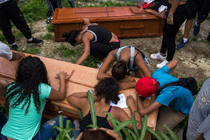 Relatives and friends mourn at the burial of Johander Perez and Wuilkerman Ruiz -- their loved ones say they were killed by FAES agents