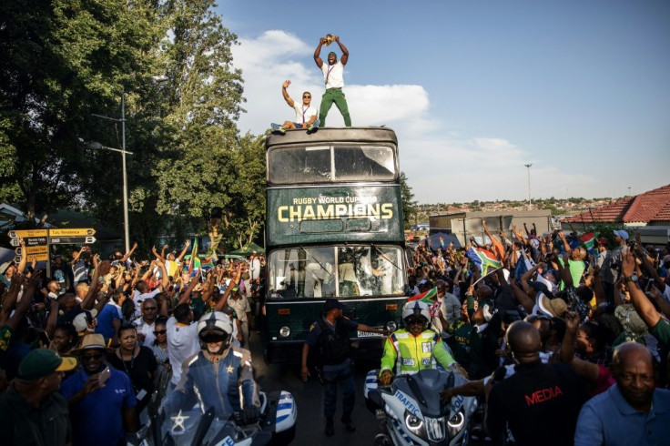 Kolisi stands proud on board the victory bus in Soweto