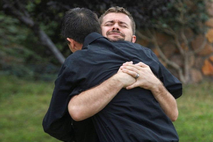 Relatives of the Mormon victims of an attack in Sonora, Mexico embrace during a wake at La Mora Ranch