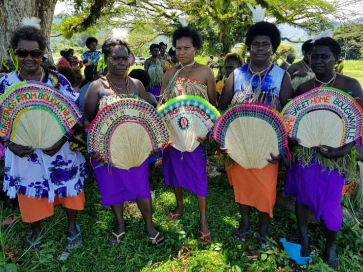 Women in tribal colours take part in a reconciliation ceremony -- part of efforts to ensure a brighter future for Bougainville
