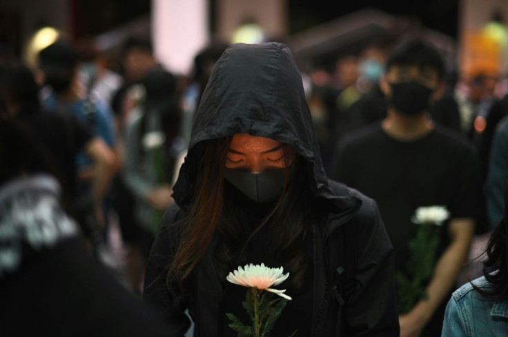 There were tearful vigils to mourn the death of a student who died during clashes with police in Hong Kong
