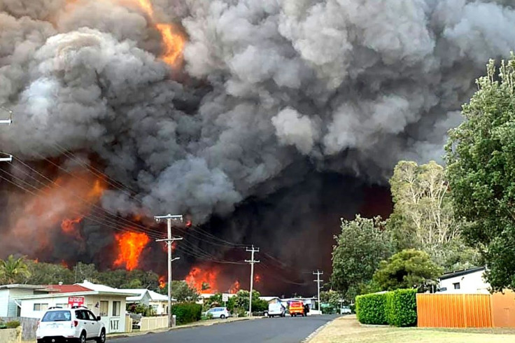 An out-of-control bushfire burns in Harrington, some 335 kilometres (210 miles) northeast of Sydney