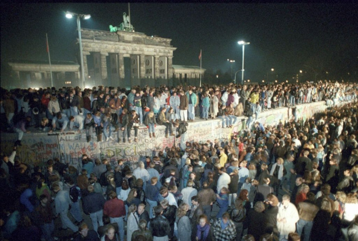 On November 9, 1989, East German border guards, overwhelmed by large crowds, threw open the gates to West Berlin, allowing free passage for the first time since it was built
