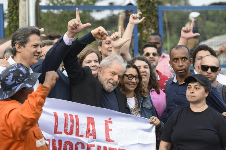 Former Brazilian President Luiz Inacio Lula da Silva gestures as he leaves the Federal Police Headquarters, where he was serving a sentence for corruption and money laundering, in Curitiba, Parana State, Brazil, on November 8, 2019