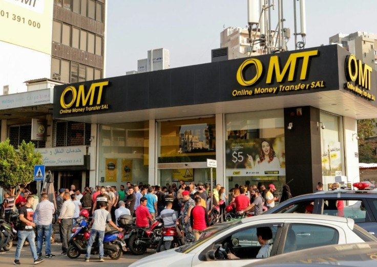 A big queue formed outside this money transfer shop in Beirut