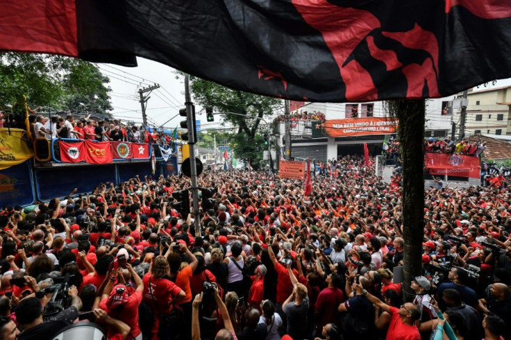 Supporters listen to Lula's address at a rally on November 9, 2019