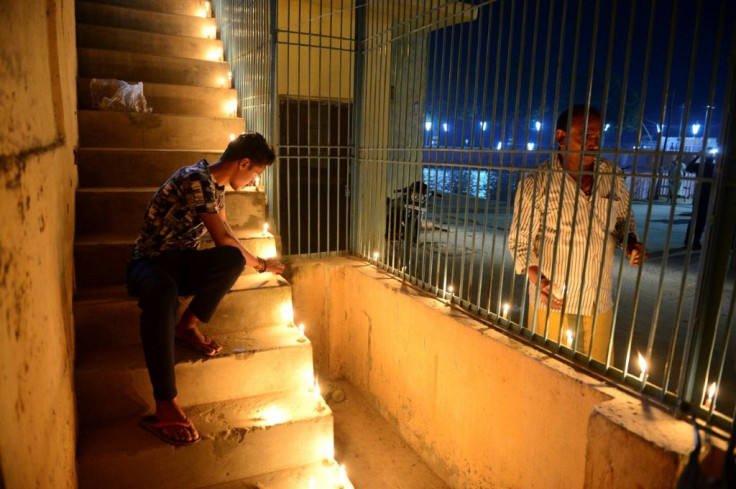 Ayodhya residents celebrate the Indian Supreme Court's verdict on the disputed religious site