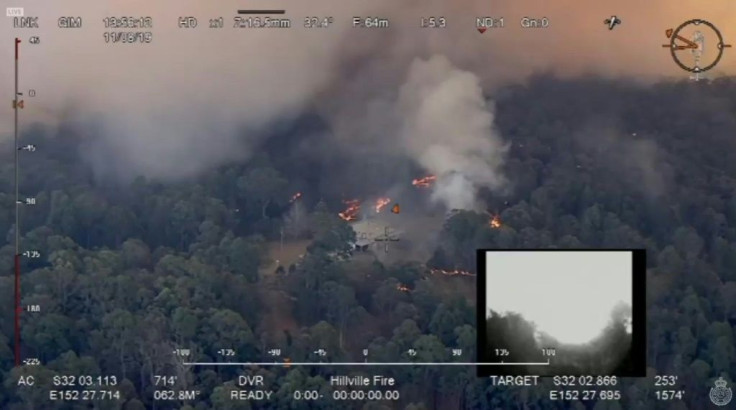 Dozens of bushfires rage out of control across eastern Australia, blocking escape routes for residents and shuttering the main highway linking major cities on the country's Pacific coast.