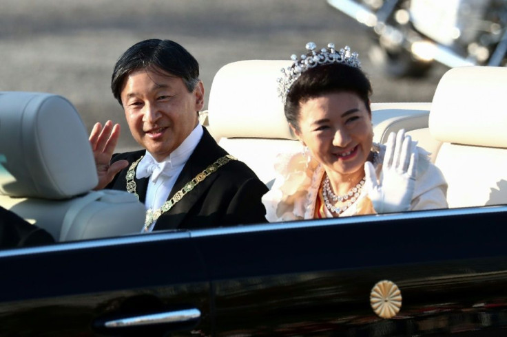 Japanâs Emperor Naruhito and Empress Masako wave during their royal parade in Tokyo