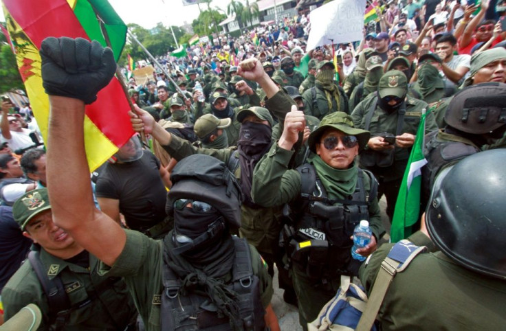 Police officers march with protesters against Bolivian President Evo Morales in Santa Cruz, Bolivia, on November 9, 2019