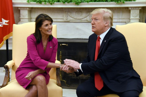 US President Donald Trump shakes hands with Nikki Haley in the Oval Office of the White House on October 9, 2018; she stepped down as UN envoy two months later