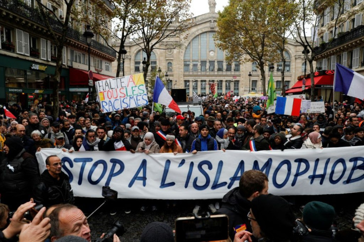 The march was called after an elderly far-right activist attacked a mosque in southern France, shooting and injuring two people