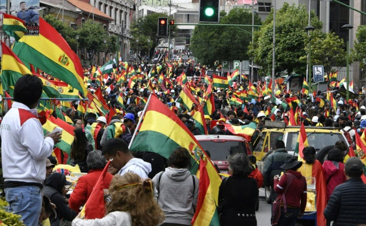 People take to the streets of La Paz to celebrate the resignation of Bolivian President Evo Morales on November 10