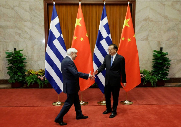Greek President Prokopis Pavlopoulos, seen with  Chinese Prime Minister Li Keqiang in Beijing in May, will meet President Xi as Athens looks to deepen economic relations