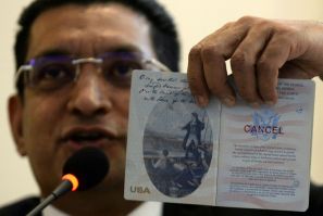 Lawyer Ali Sabry holds a document that is purportedly the cancelled US passport of Sri Lanka presidential candidate Gotabhaya Rajapakse