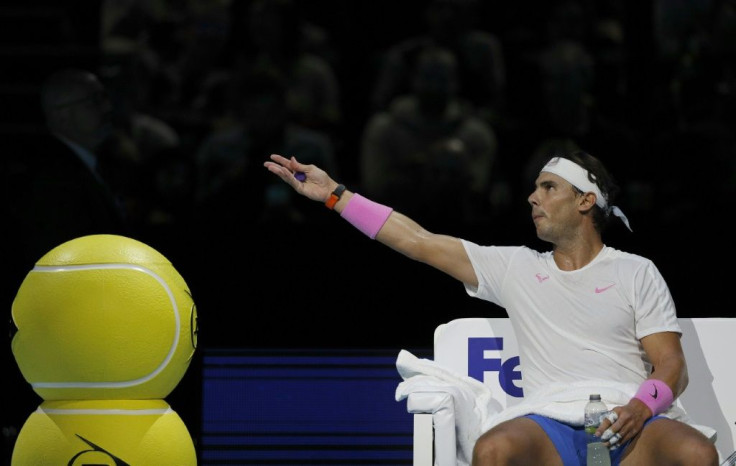 Rafael Nadal remonstrates with the umpire during a break in play against Alexander Zverev at the ATP Finals