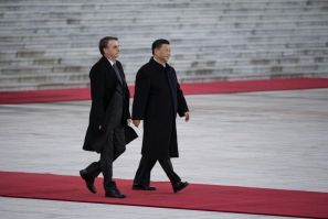 President Jair Bolsonaro (L) will walk a diplomatic tightrope as he hosts his Chinese counterpart Xi Jinping (R) in Brazil