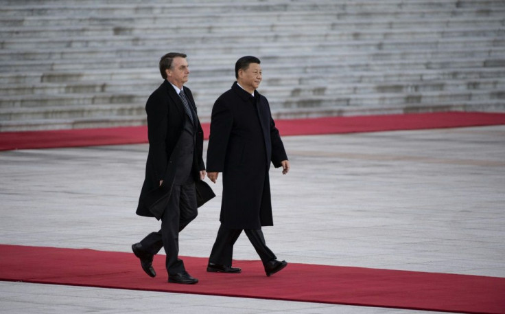 President Jair Bolsonaro (L) will walk a diplomatic tightrope as he hosts his Chinese counterpart Xi Jinping (R) in Brazil