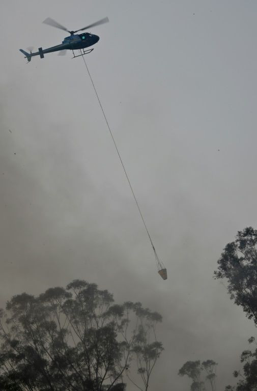 Thousands of firefighters are tackling blazes across eastern Australia, their work hampered by high temperatures and strong winds