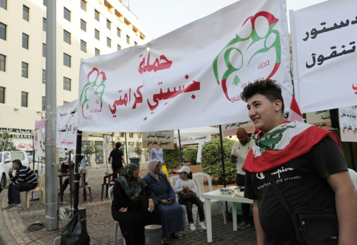 Omar, a 17-year-old activist helps at Lebanon's "My Nationality, My Dignity" campaign booth during anti-government demonstrations in downtown Beirut