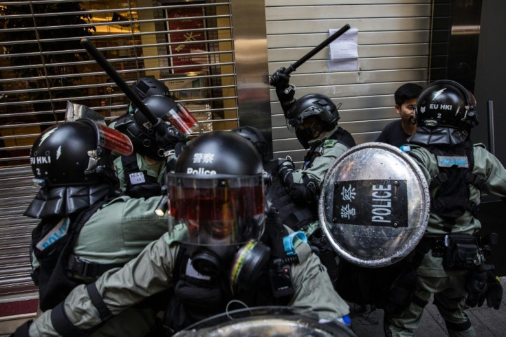 The city witnessed one of the most violent days yet in five months of unrest on Monday, with a police officer shooting a masked student and a pro-Beijing man set on fire