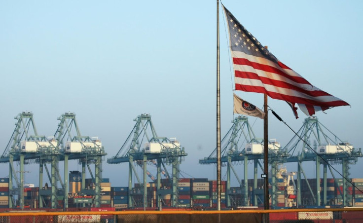 Shipping containers are stacked at the Port of Los Angeles on November 7