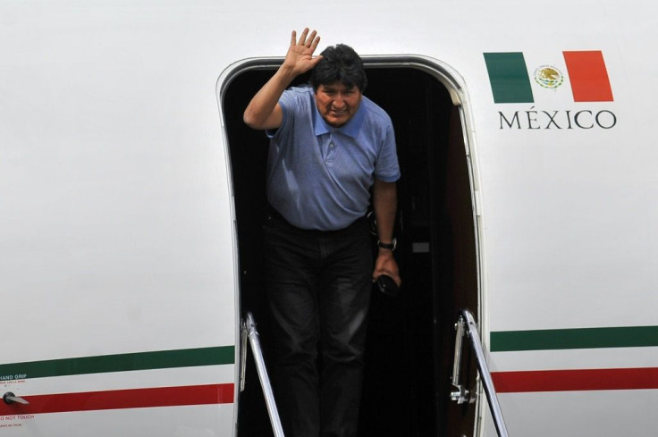 Bolivian ex-President Evo Morales waves upon landing in Mexico City, on November 12, 2019, where he was granted exile after his resignation