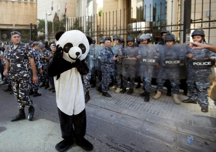 Lebanese protesters - including one dressed in a panda suit - tried to prevent judges and lawyers from going to work