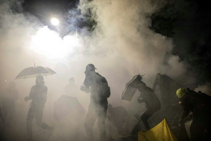 Police fired tear gas after night fell