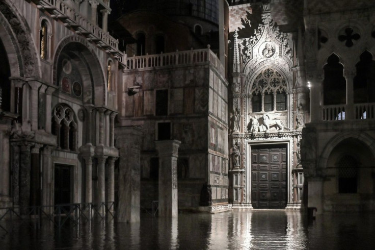 St. Mark's Basilica and a part of the Doge's Palace (R) are pictured on the flooded St. Marks' Square on November 12