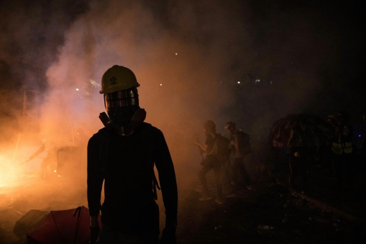 Hong Kong investors are  bracing for fresh unrest after the city saw another night of chaos