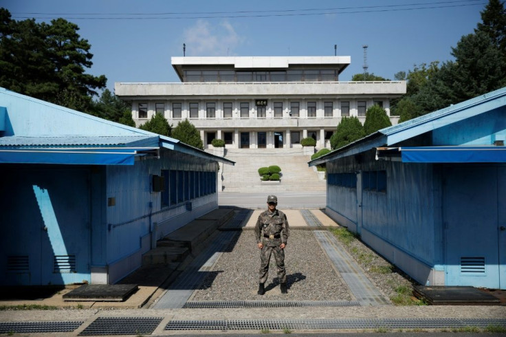 The alleged North Korean murderers were handed back to Pyongyang authorities at Panmunjom inside the demilitarized zone